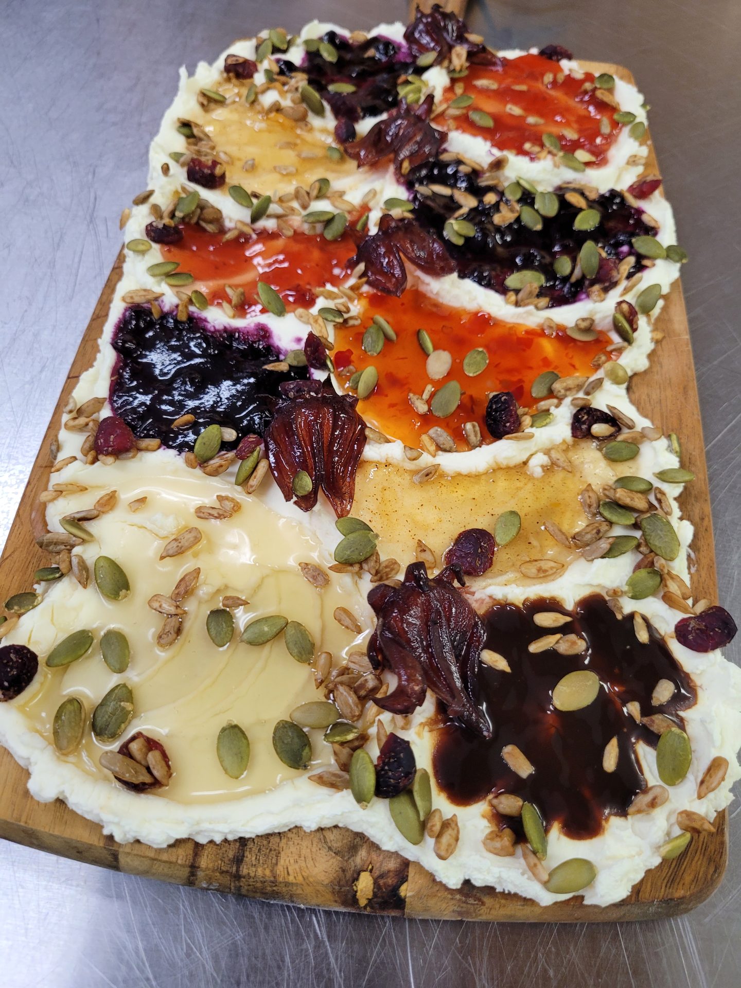 Artisan butter board with house-made jams, dried fruit, and pumpkin seeds